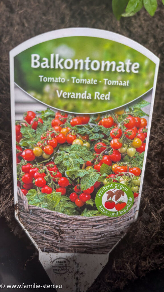 kleines Schild mit einem Bild der Balkontomate